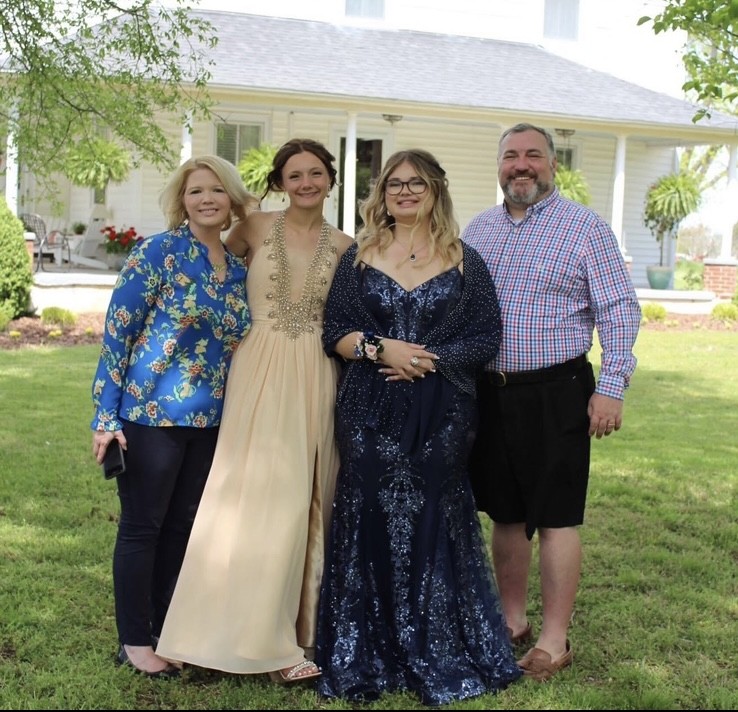 Matt Hiers with his wife and two daughters.